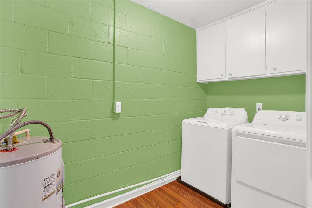 Utility room in townhome with new washer and dryer.