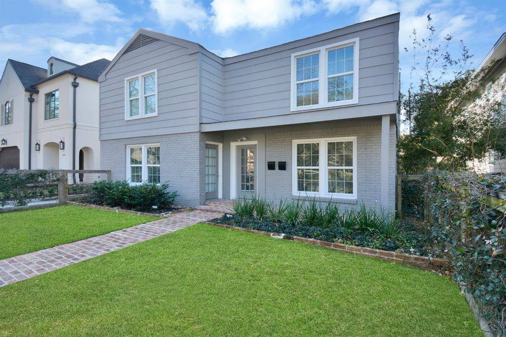Inviting front porch with a view of the fully fenced front yard.