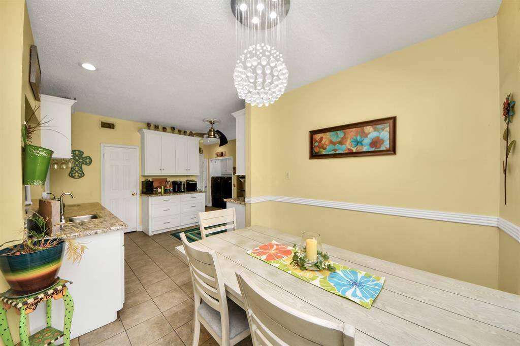 Another angle of the dining room, showcasing its warm, inviting atmosphere making it perfect for gatherings.