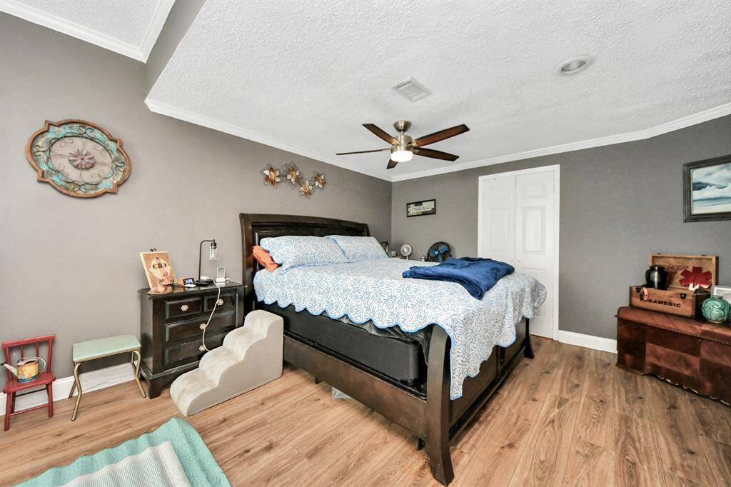Spacious primary bedroom tucked away downstairs for added comfort and privacy.