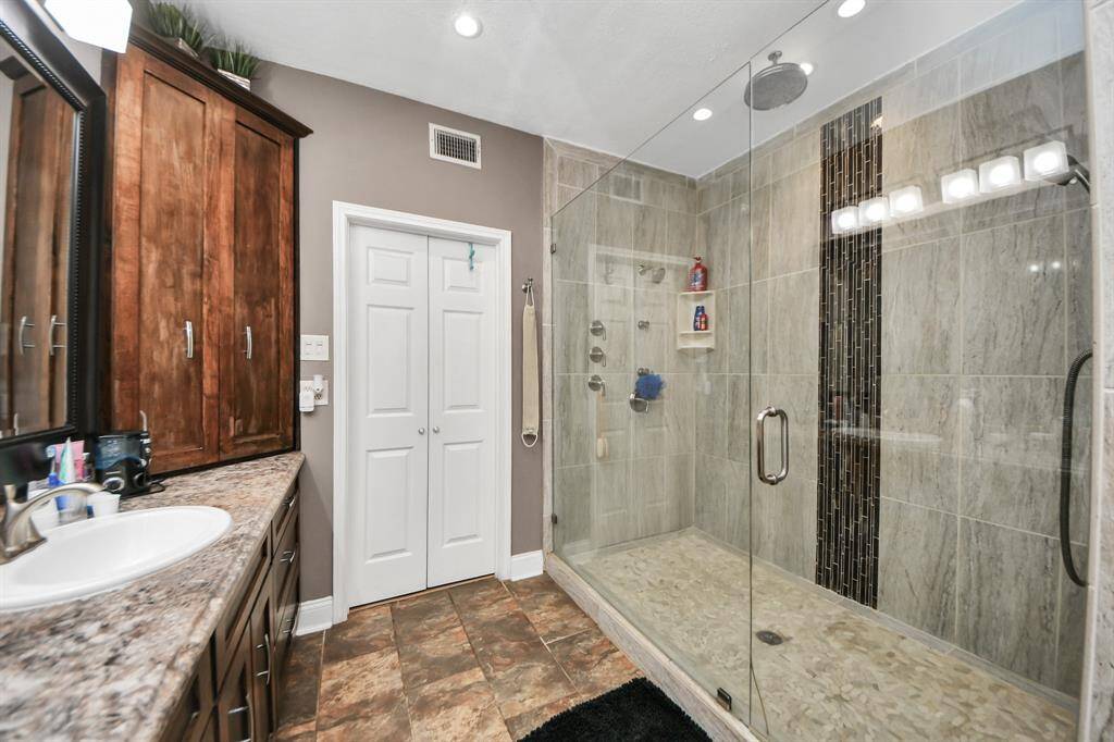 Another look at the beautiful primary shower, showcasing its sleek design and spacious feel.