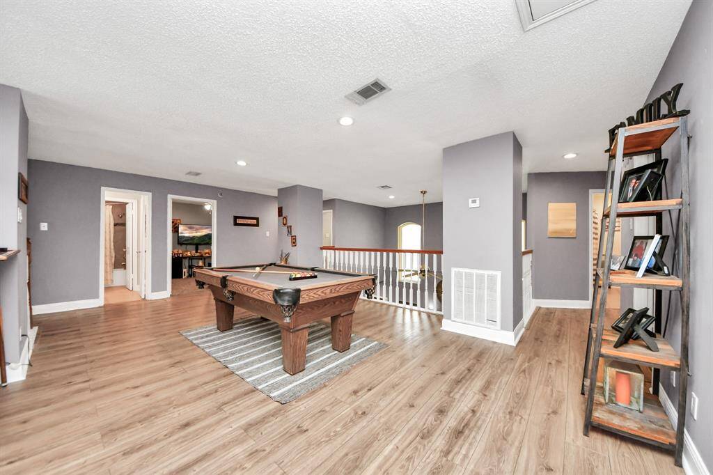 Spacious game room with endless possibilities. Currently set up with a pool table that can stay with the home.
