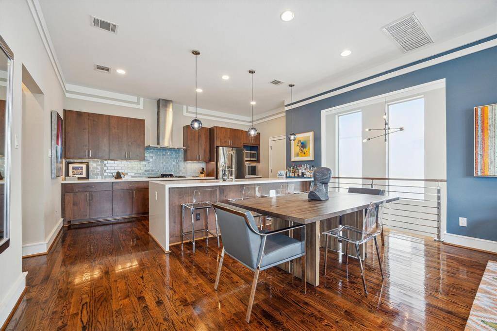 View of the dining area and kitchen. Wonderful home to entertain in.