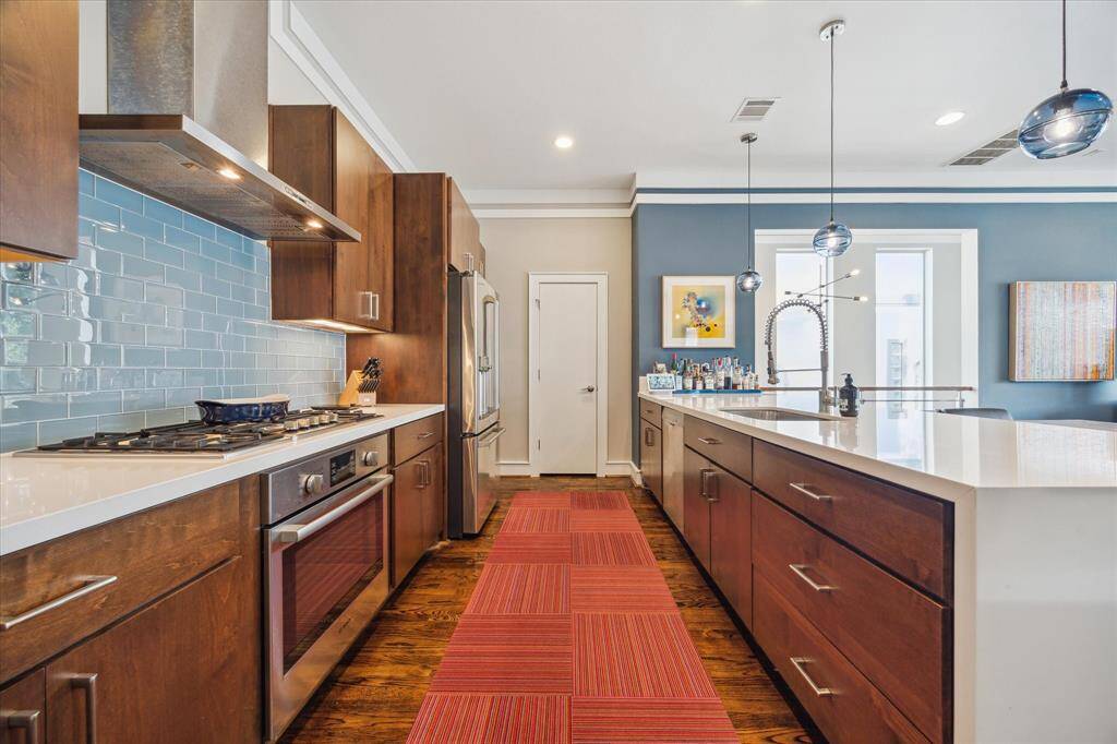 Bosch stainless steel appliances in the kitchen. Also and abundance of storage and counter space for cooking.