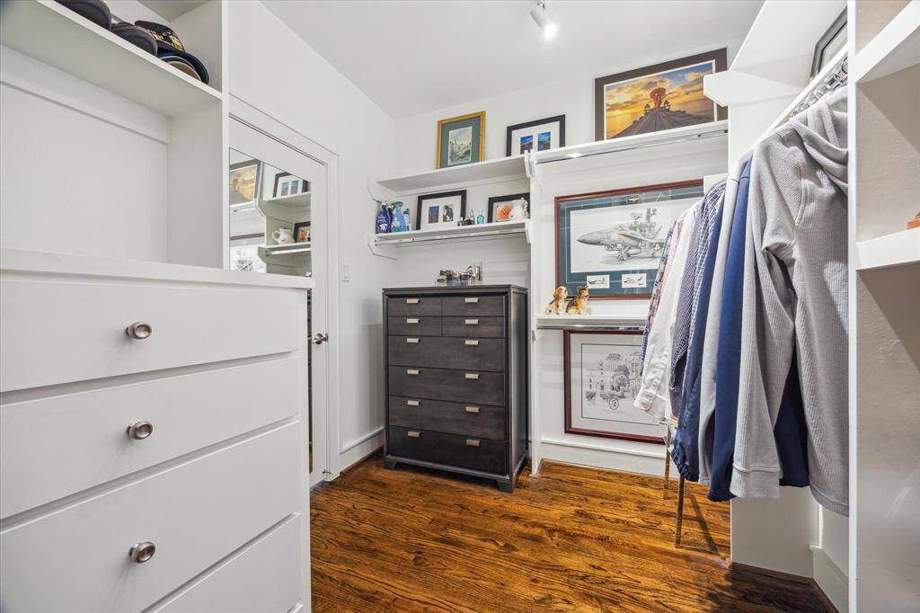 One of the two primary bedroom closets. Lots of hanging space and built-ins.