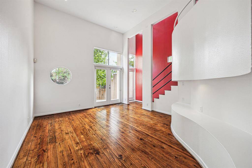 First view upon entry. Living room to back yard and deck.