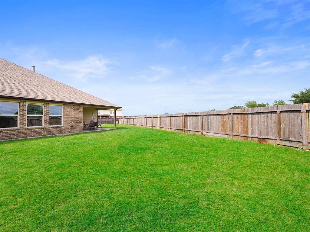 spacious back yard with covered patio and no back neighbors!