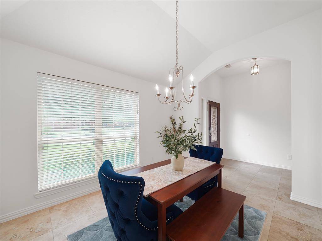 by changing the light fixture the formal dining can easily be repurposed for open office or formal living room
