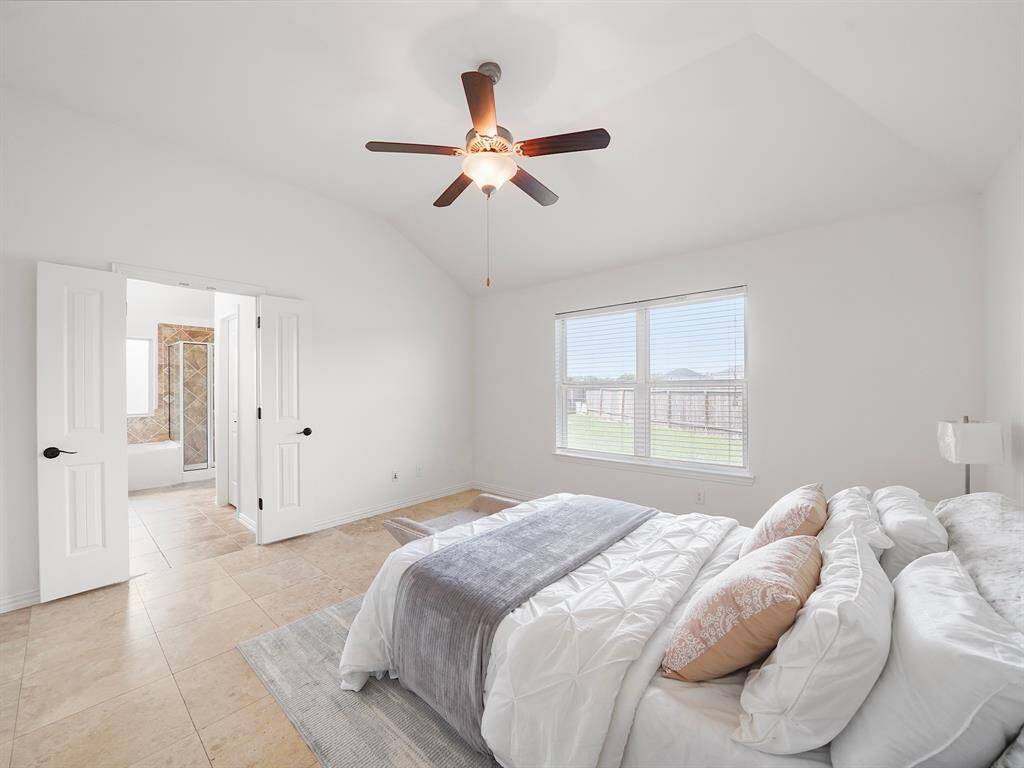 Primary Bed featuring Vaulted ceilings internet/cable connections and en-suite