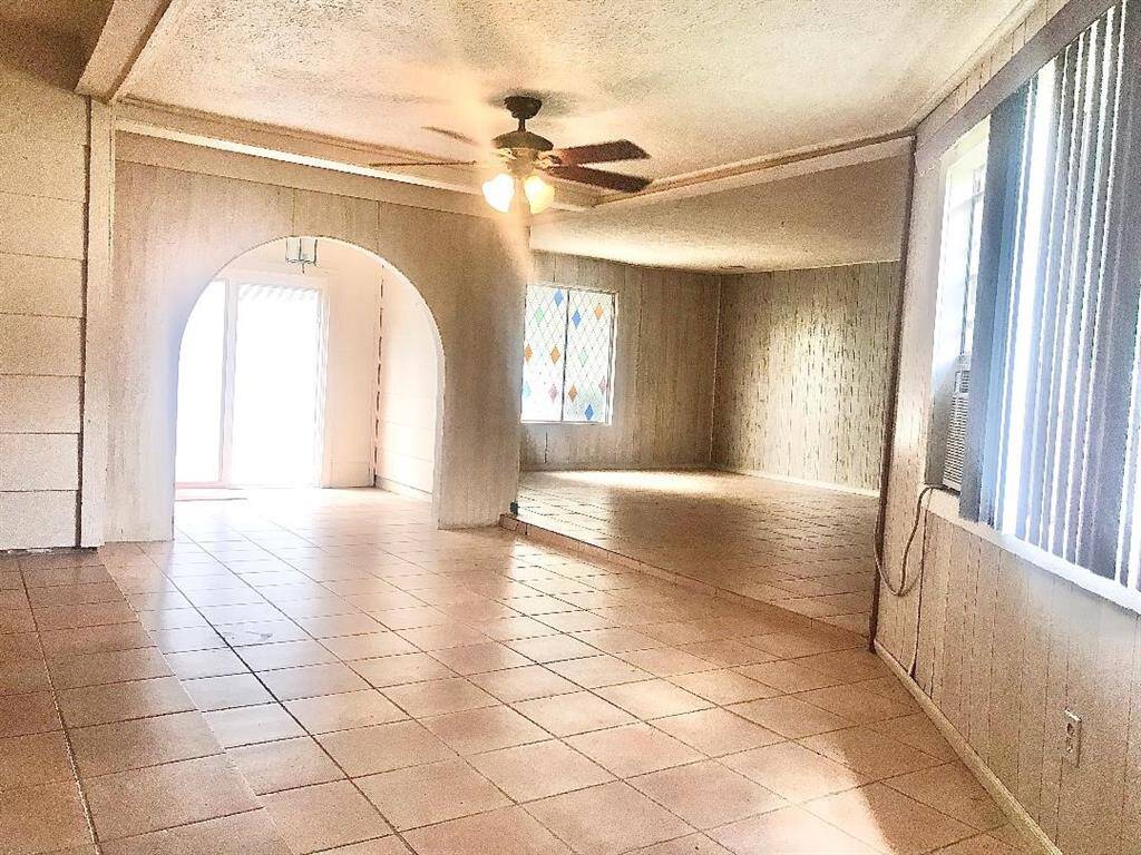 This is a view ow the bonus, family/game/media rm flex space with view to the back inside entry