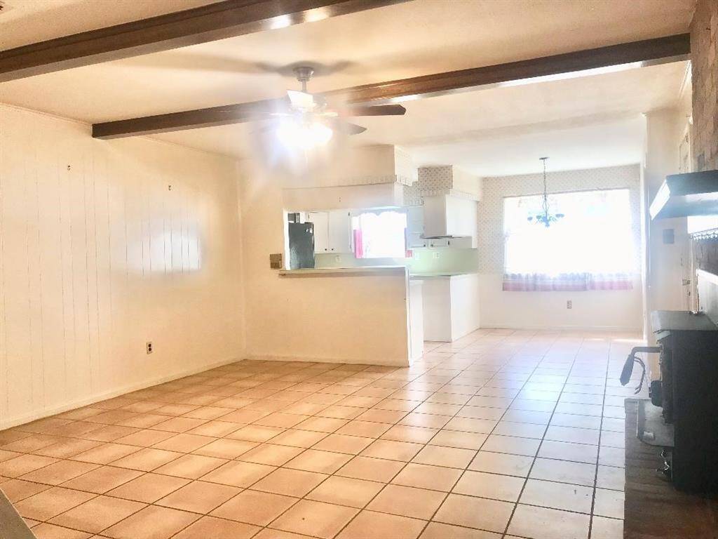 Back to the den that connects to the kitchen, breakfast area and laundry/half bath rm