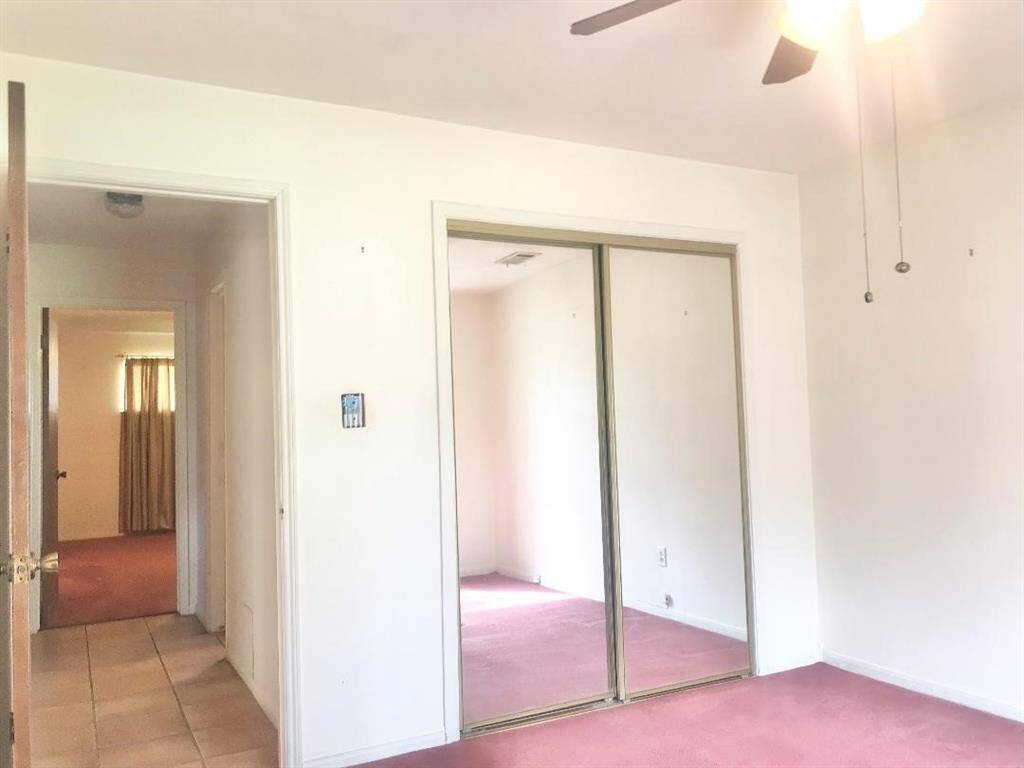 Across the hall from the primary bd rm is another 1st floor bed rm perfect of guests or those that need to be on the 1st floor.