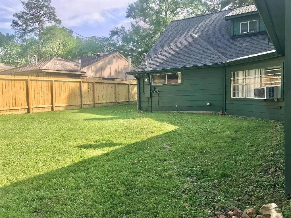 View of the back yard which is fully fenced