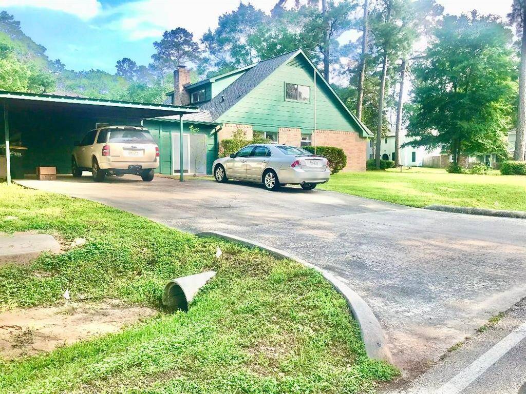 Another view of the 2 car carport & space for lots of cars