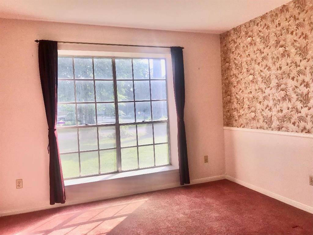 View of the dining rm from the kitchen out the window to the front yard