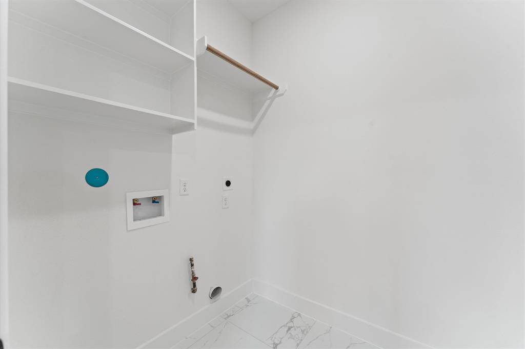 Laundry Room on Level II in between the primary bedroom and Secondary Bedrooms