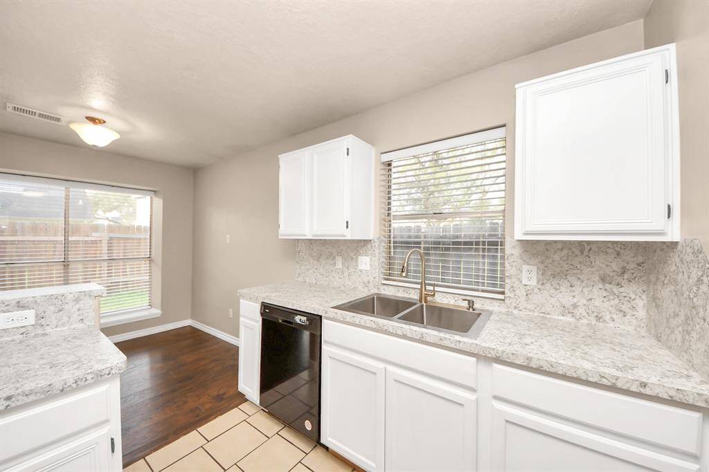 Designed for both functionality and style, this kitchen offers generous counter space for all your culinary needs.