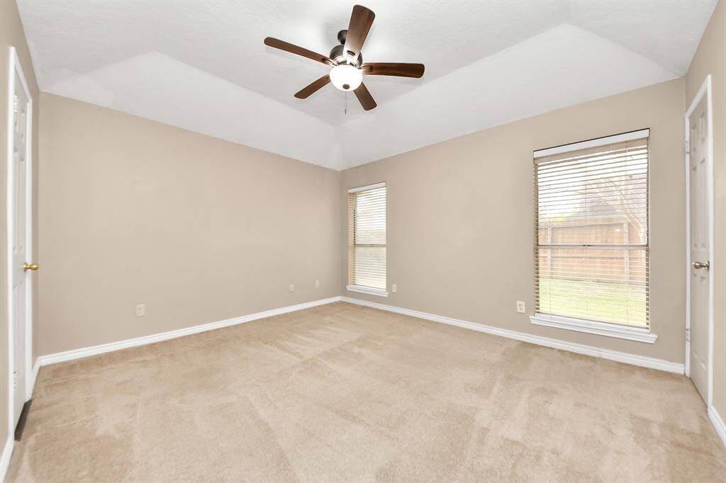 Designed for comfort and style, this spacious bedroom offers a bright and airy retreat.