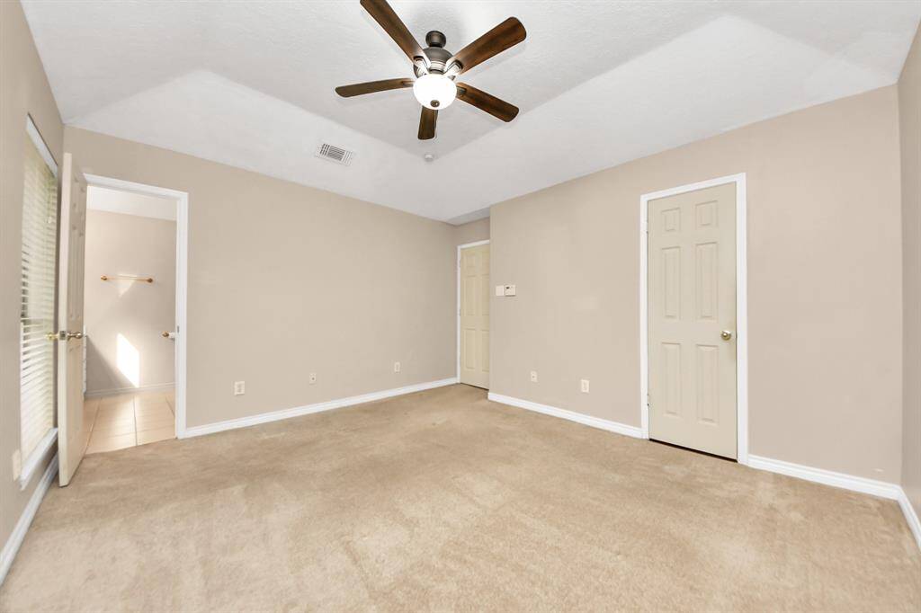 A seamless flow between the primary bedroom and its luxurious ensuite bathroom.