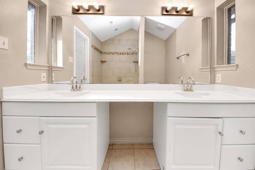 Thoughtfully designed for two, this primary bathroom ensures both style and convenience.