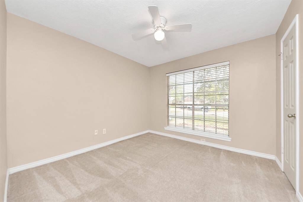 A versatile secondary bedroom, perfect for guests, home office, or personal retreat.