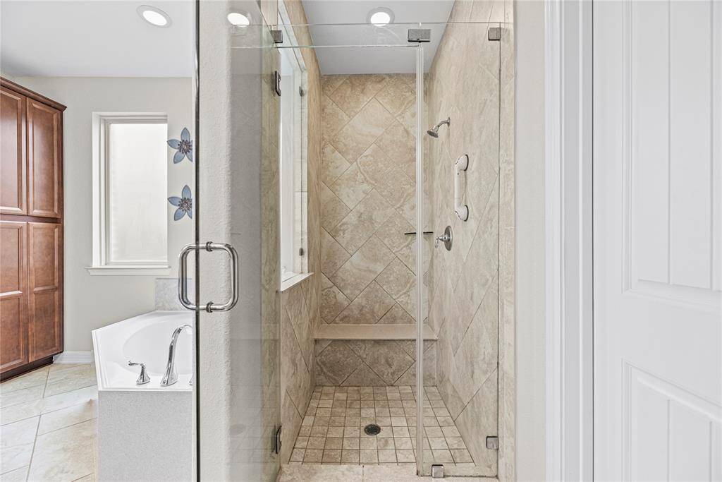Unwind in your deep soaking tub or jump in the separate shower for a quick rinse.