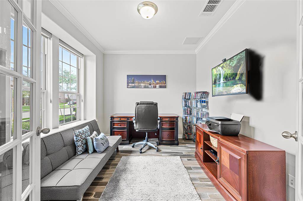 To the left of the entry, through double glass doors is your private study for focus and quiet during those work from home days. This could also be an ideal first floor play room to keep the little ones close and the toys tucked away!