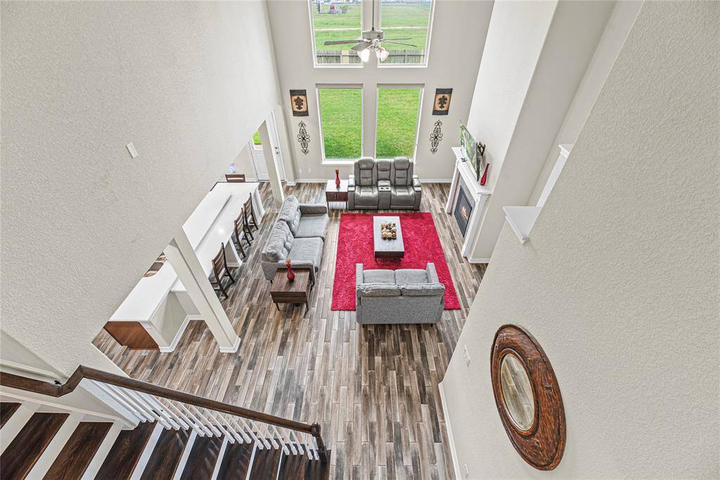 A view from above showcasing the open floorplan, the living space and just the wow of the home!