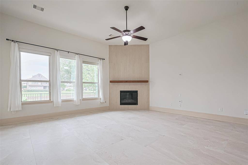 Open concept kitchen, breakfast area and living has views to the lake