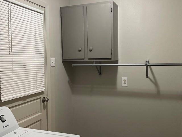 utility room with full size washer/ dryer