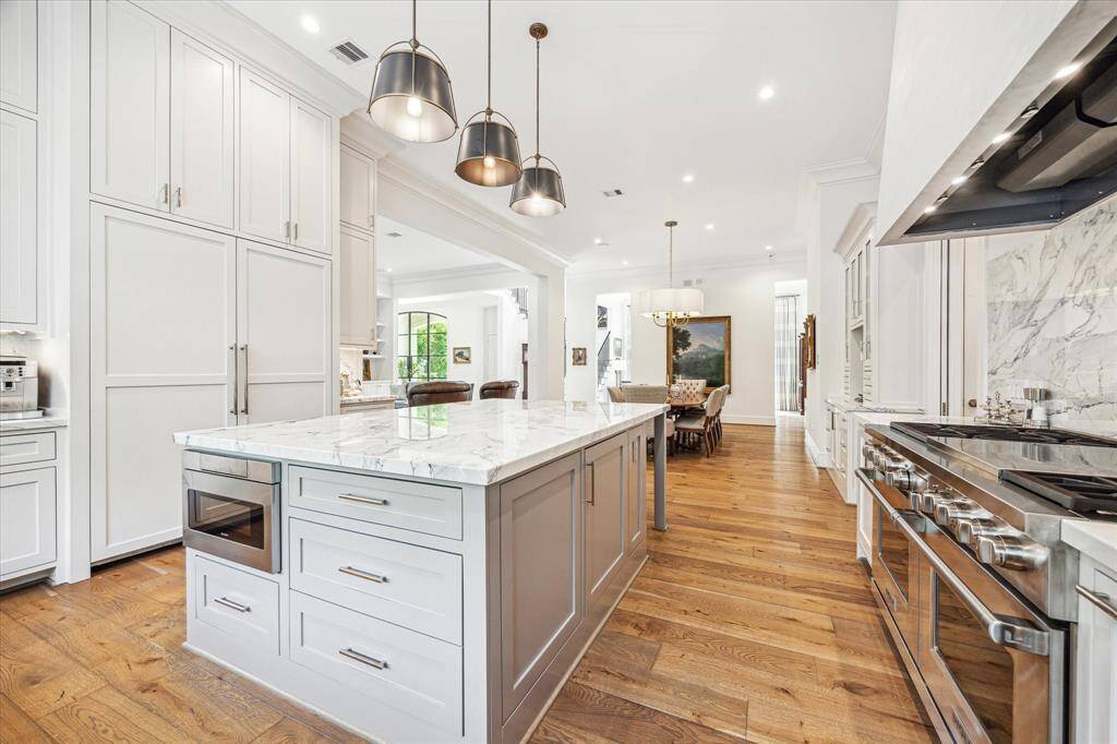 With a Wolf 6 burner gas range, a Jennair warming drawer, Bosch dishwasher and  Liebherr refrigerator and freezer, , this kitchen is fit for the most discerning cook.  The adjoining pantry provides additional storage and prep space.