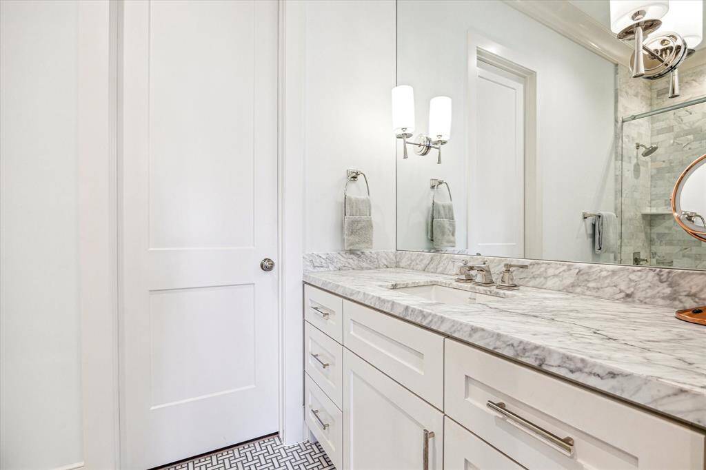Secondary bathroom with soaking tub and shower combo.