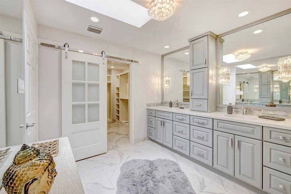 Gorgeous primary bathroom-with a sliding barn door to the walk in closet.  Super Fab.