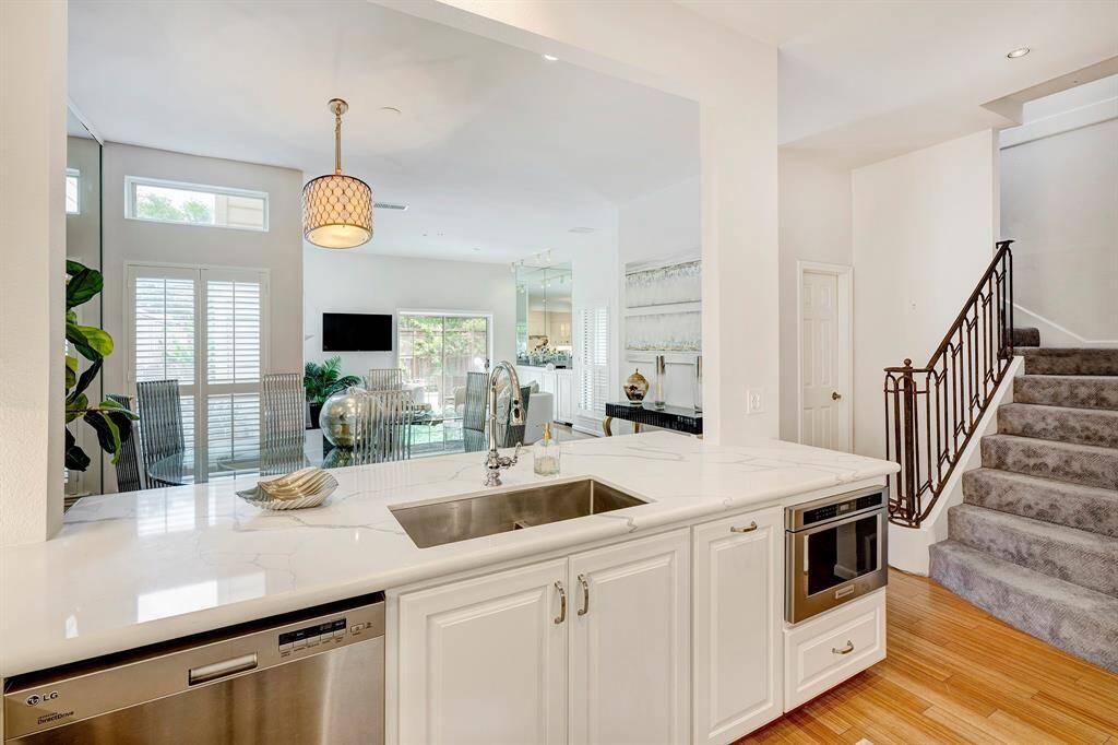 Stainless appliances, iron stairway rail.