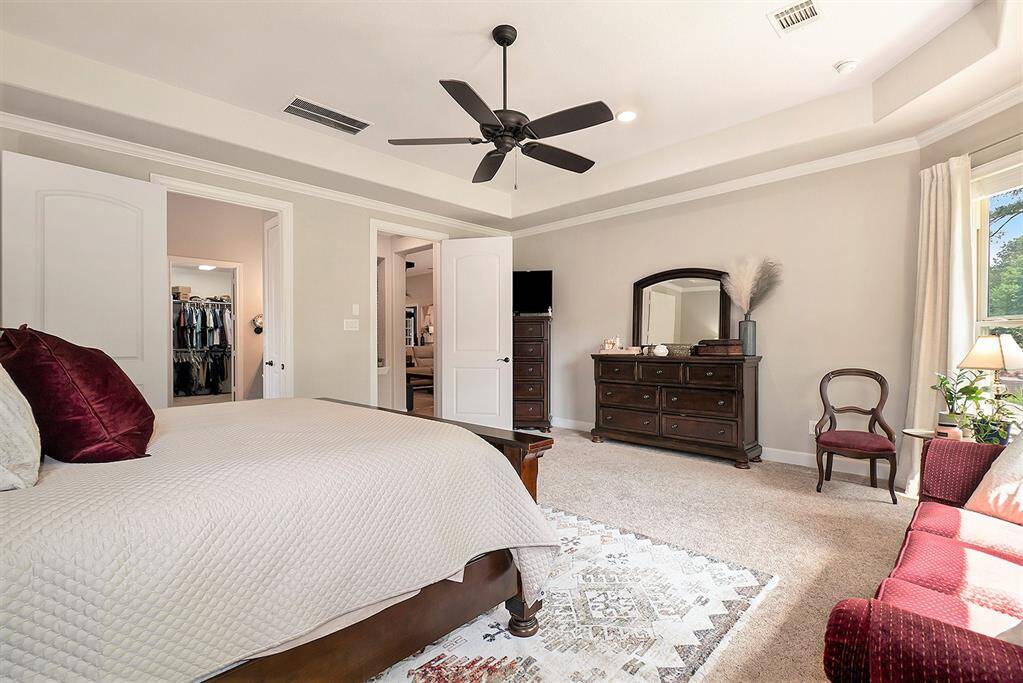 Primary bedroom with carpet