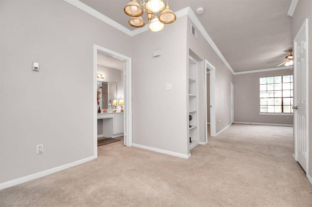 The spacious primary bedroom connects to an en-suite bath and out to the main living area.