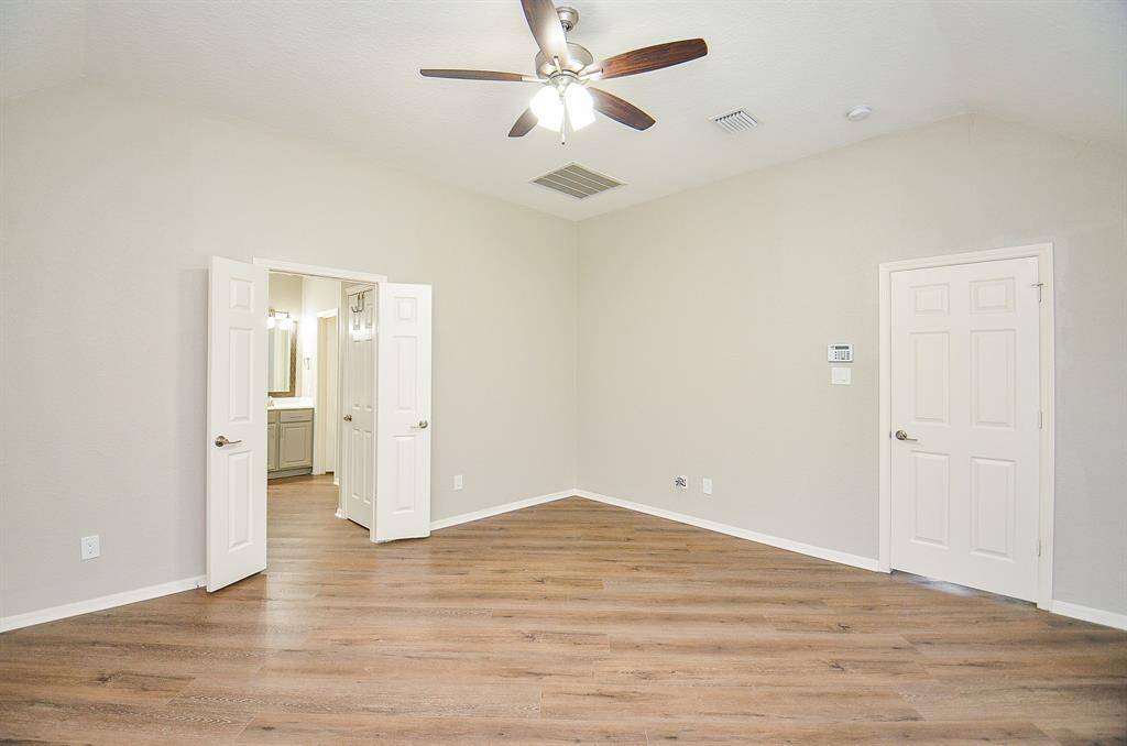 Double doors open onto your primary ensuite bath.