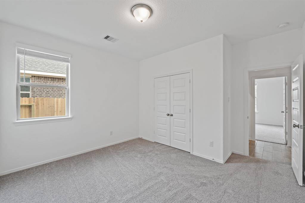 Splendid Secondary Bedroom that offers plush carpeting, natural lighting, and easy access into the Striking Secondary Bathroom!