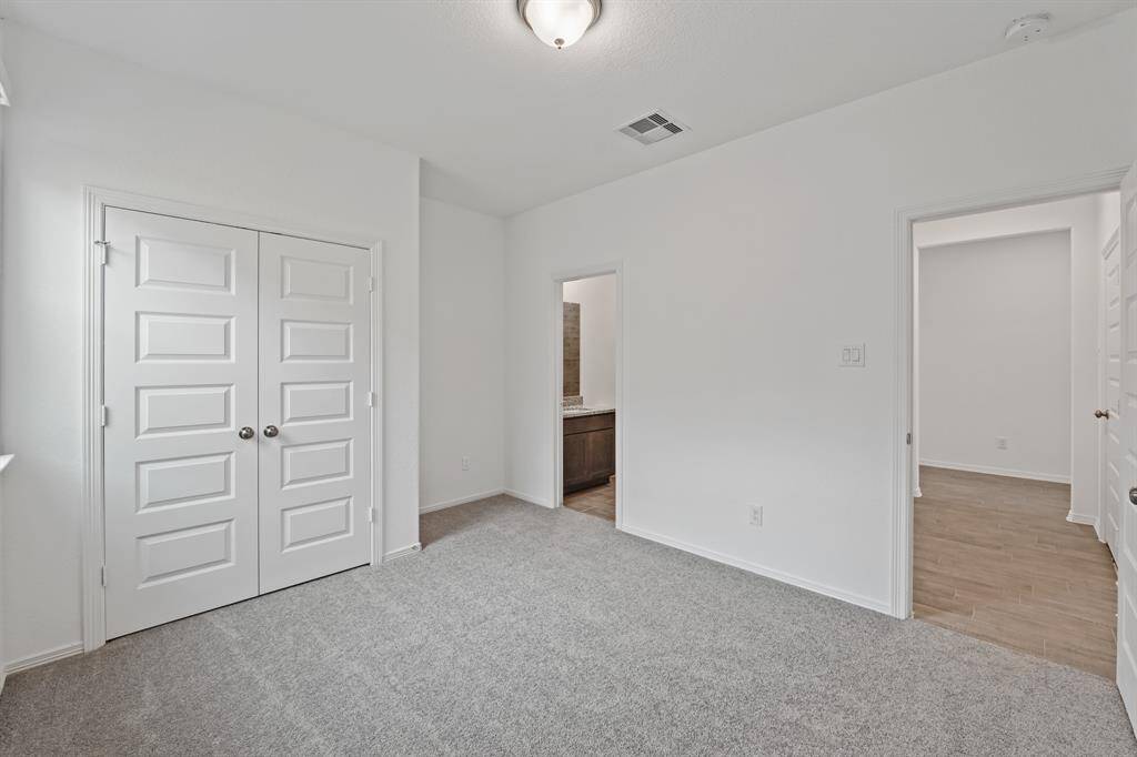 Splendid Secondary Bedroom that offers plush carpeting, natural lighting, and easy access into the Striking Secondary Bathroom!