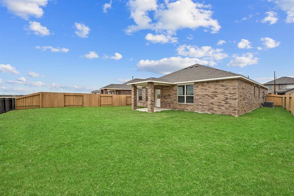Enjoy the Lakefront breeze from your Cozy Covered Back Patio while watching the kids or pets play!