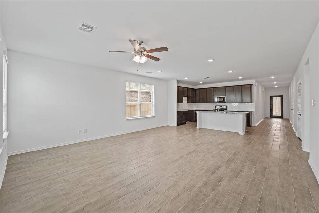 Beautiful Open Concept floorplan with lots of light, great for entertaining! Luxurious Living Room and Dining Area with abundance of space to make your own.