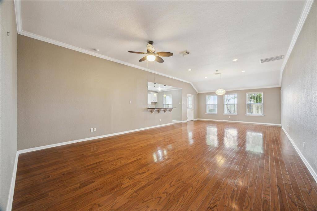 GORGEOUS WOOD FLOORING THROUGHOUT LIVING AND DINING AREA/ CROWN MOLDING
