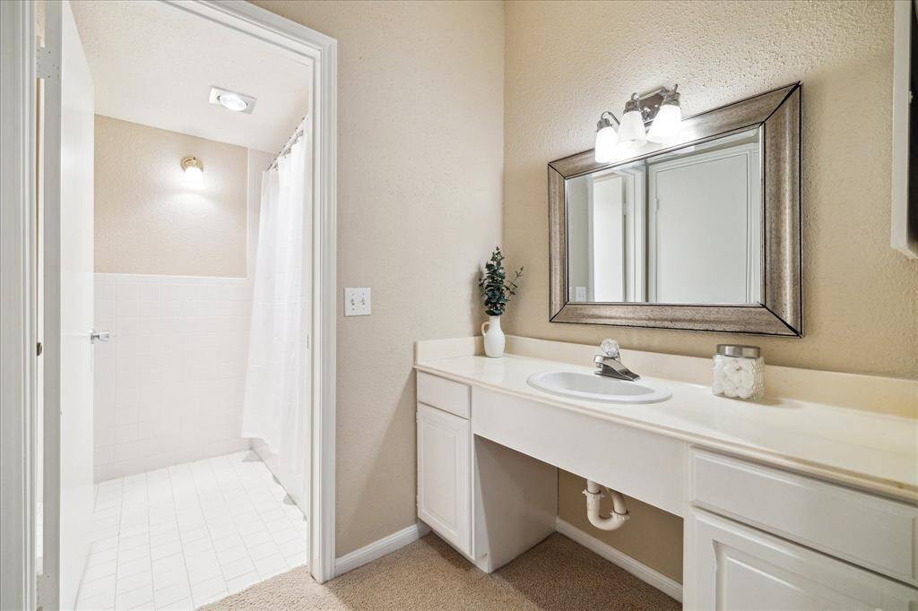View of the primary bedroom vanity area.