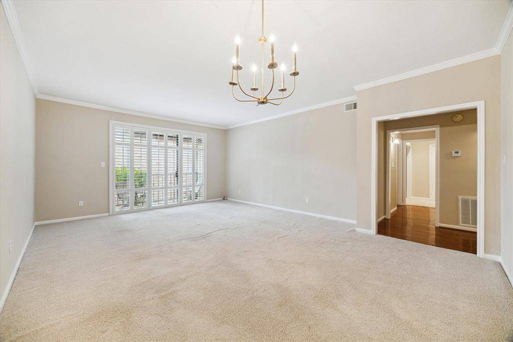 Another view of the living/dining rooms. The door way leads to the bedrooms.