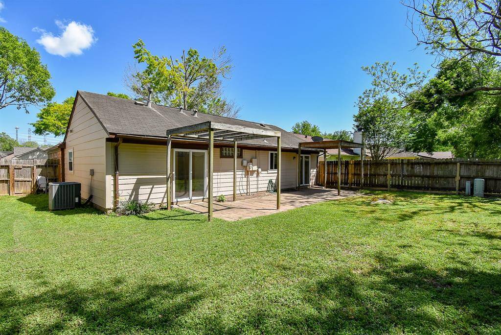 Spacious rear yard. Room to play/kick a ball and for dogs to roam