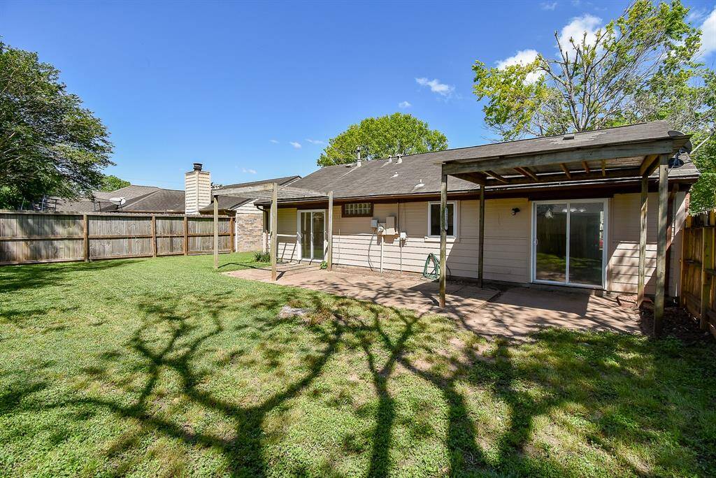 Back yard with covered patio