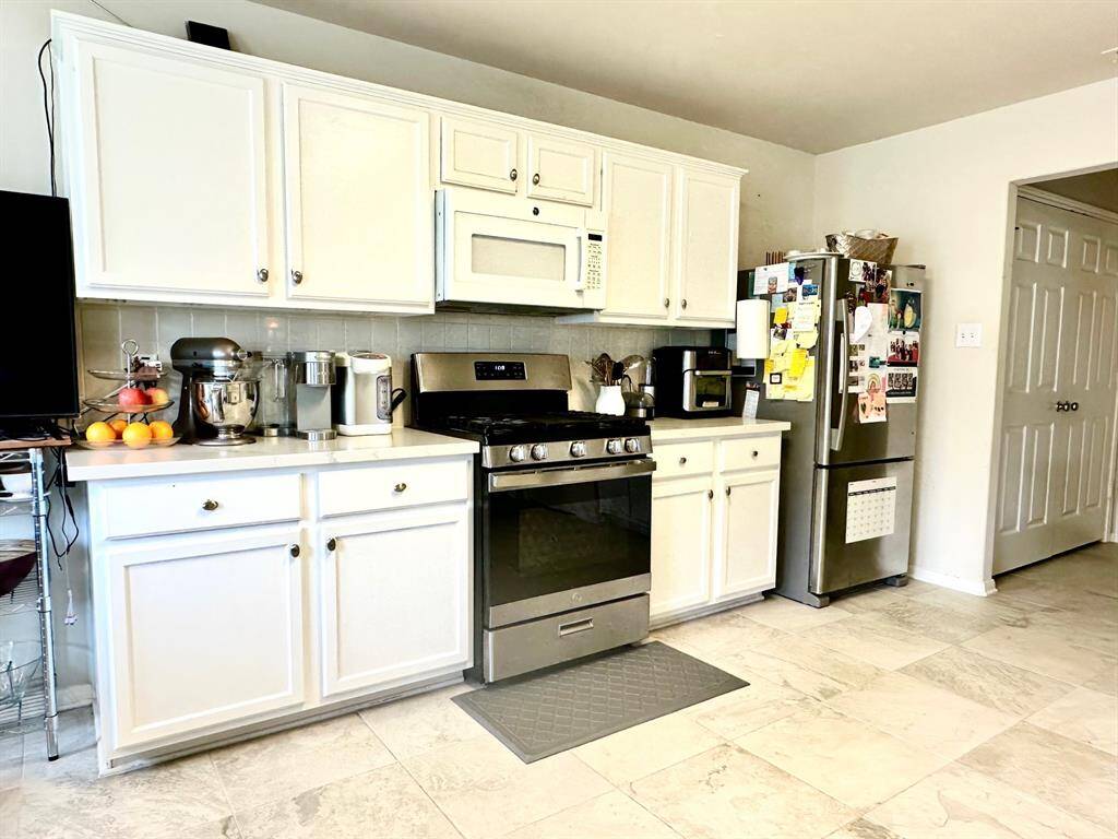 Kitchen includes a recently replaced gas range and dishwasher.