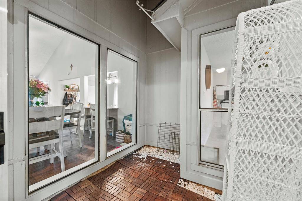 A sunroom that could be used as a cozy retreat or storage area.