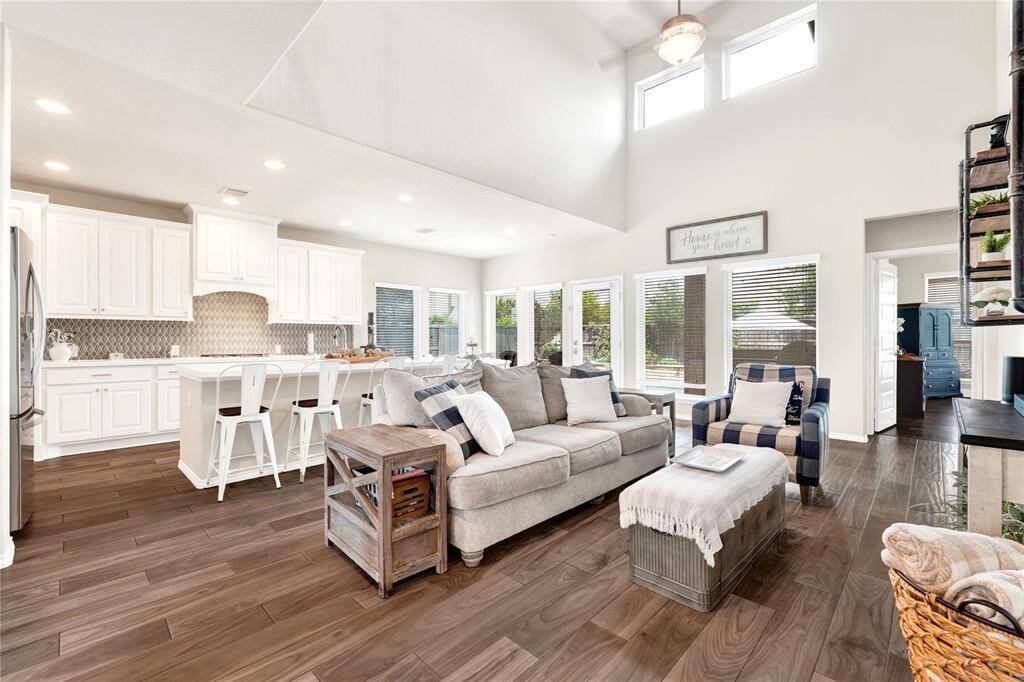 Open concept living room connected to gourmet kitchen