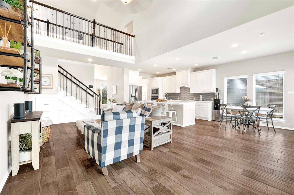 Grand Staircase and luxury flooring all throughout home